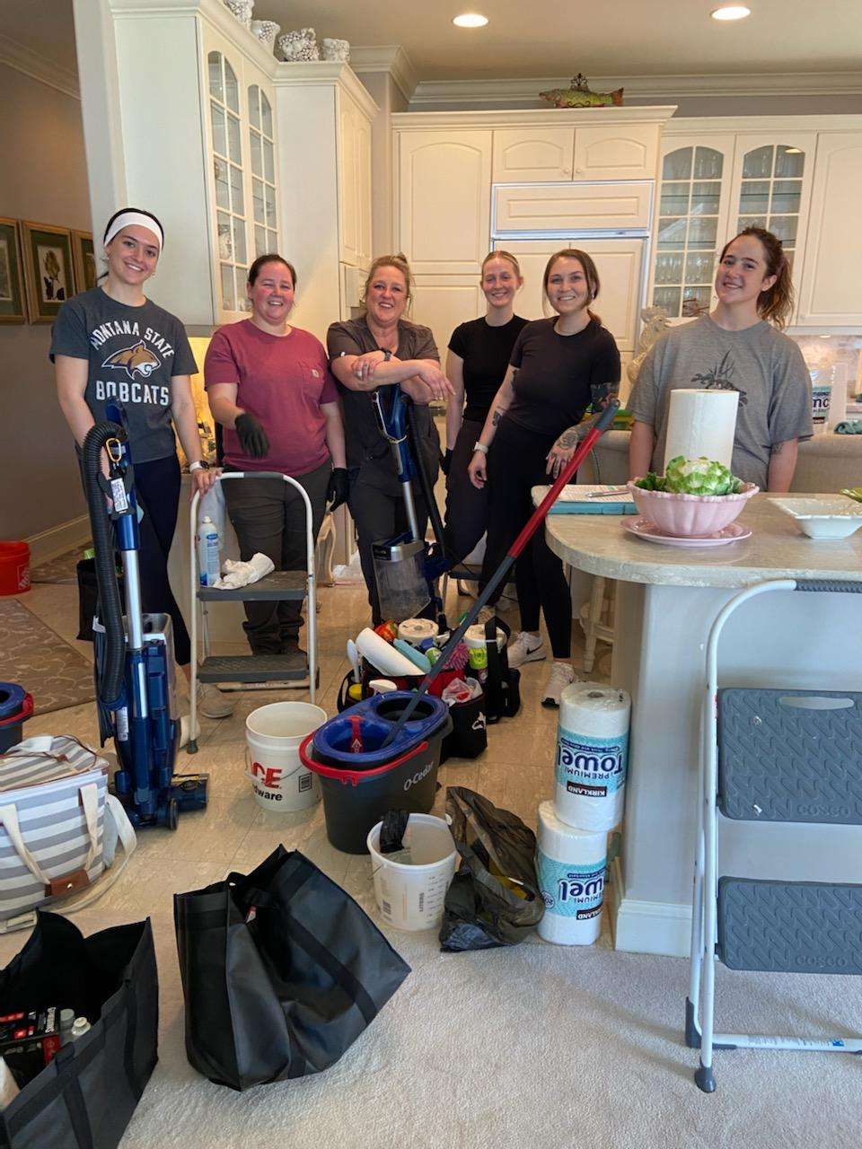 Blessed Cleaners home cleaning team ready with supplies in a Winnipeg kitchen